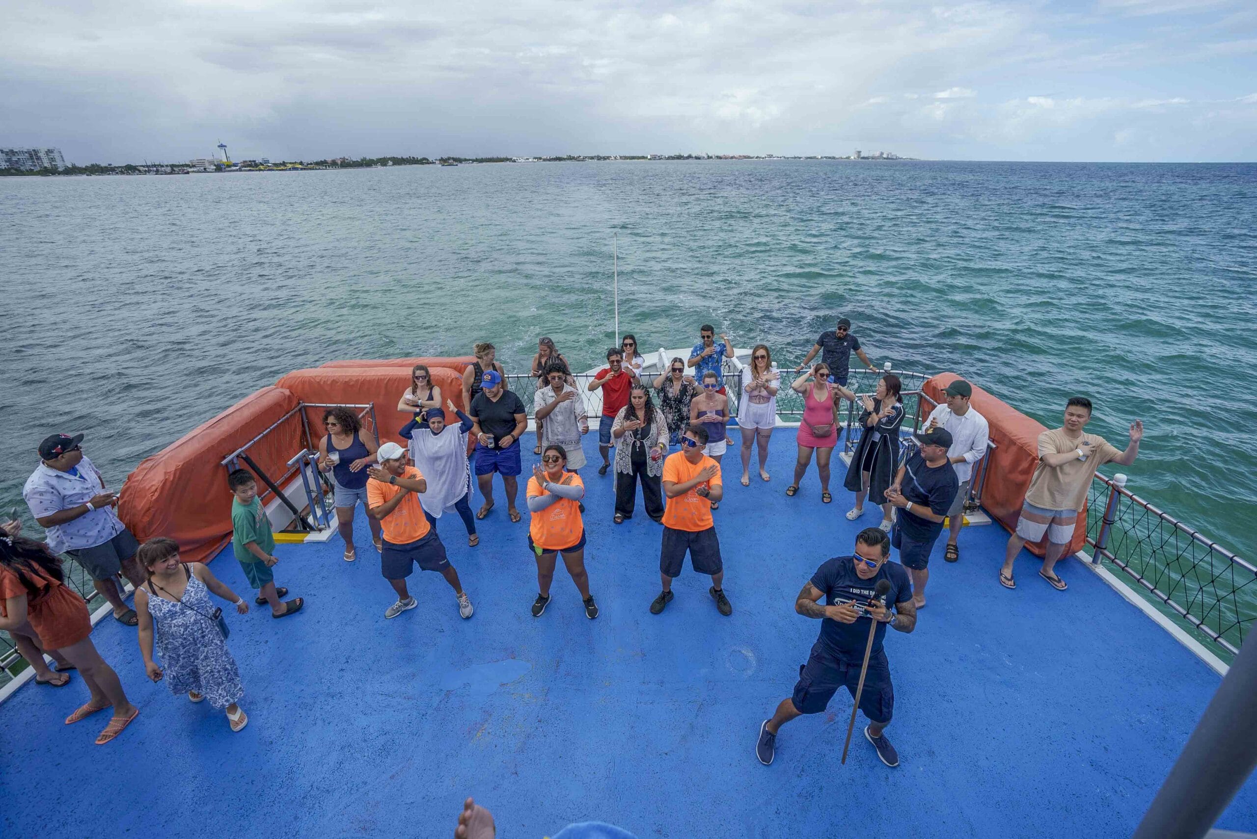Guests dancing on Dancer Catamaran party deck