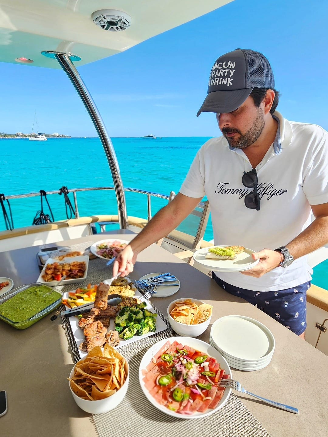 Mauricio Mau Bravo enjoying a spectacular chef-prepared lunch on an 80 foot Azimut yacht